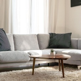 oversized windows brighten spacious, furnished living room