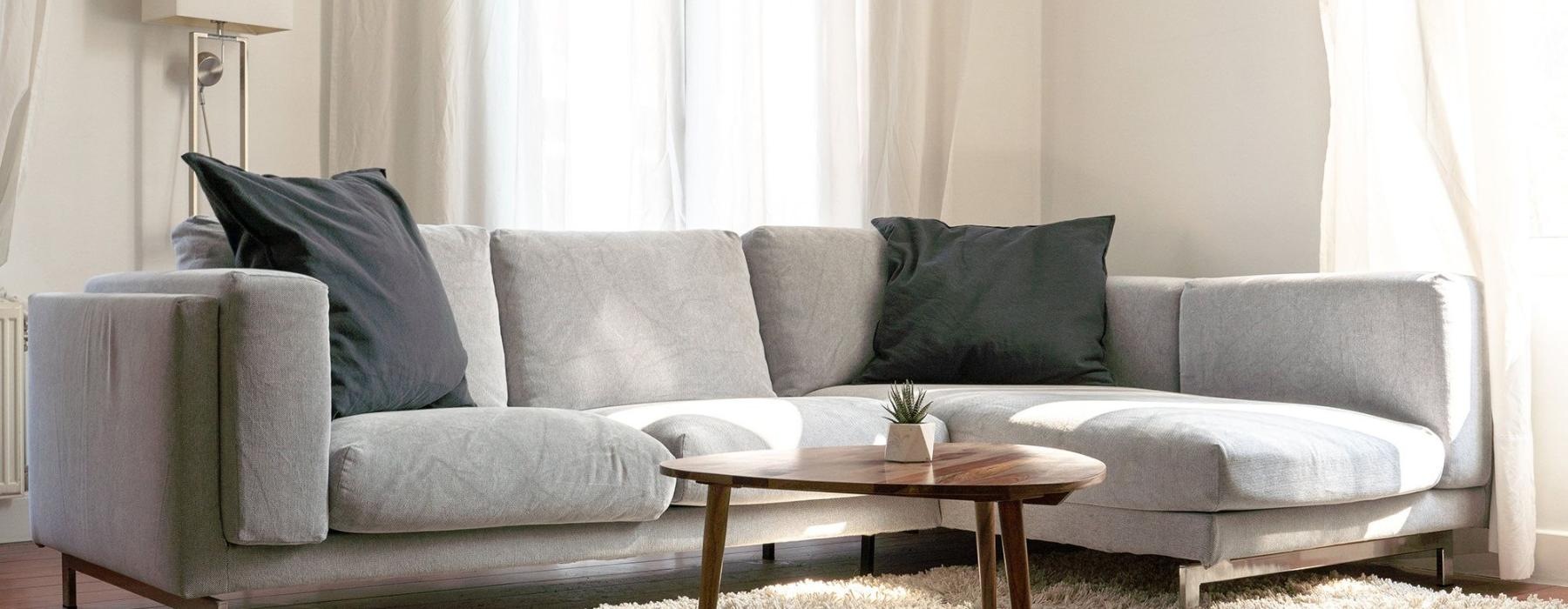 oversized windows brighten spacious, furnished living room