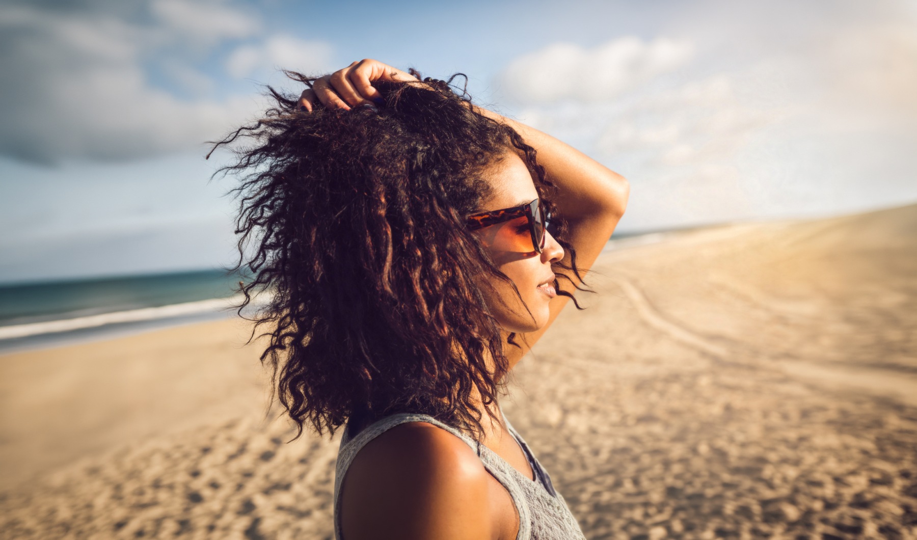 a woman with her hair blowing in the wind
